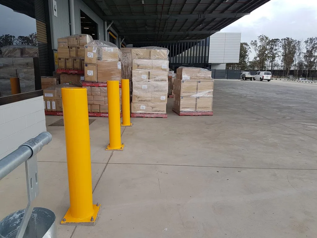 Steel safety bollards installed at a loading dock